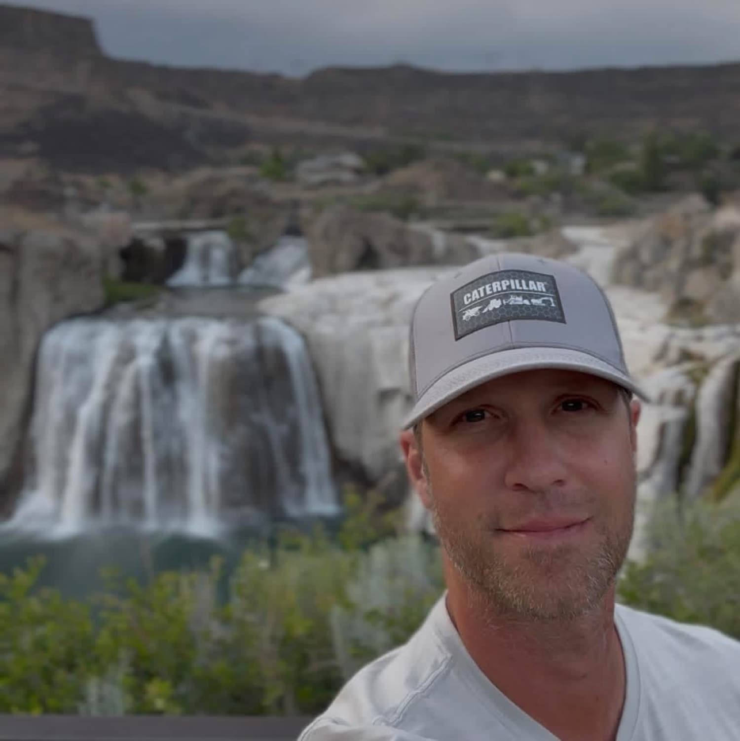 George in front of a waterfall