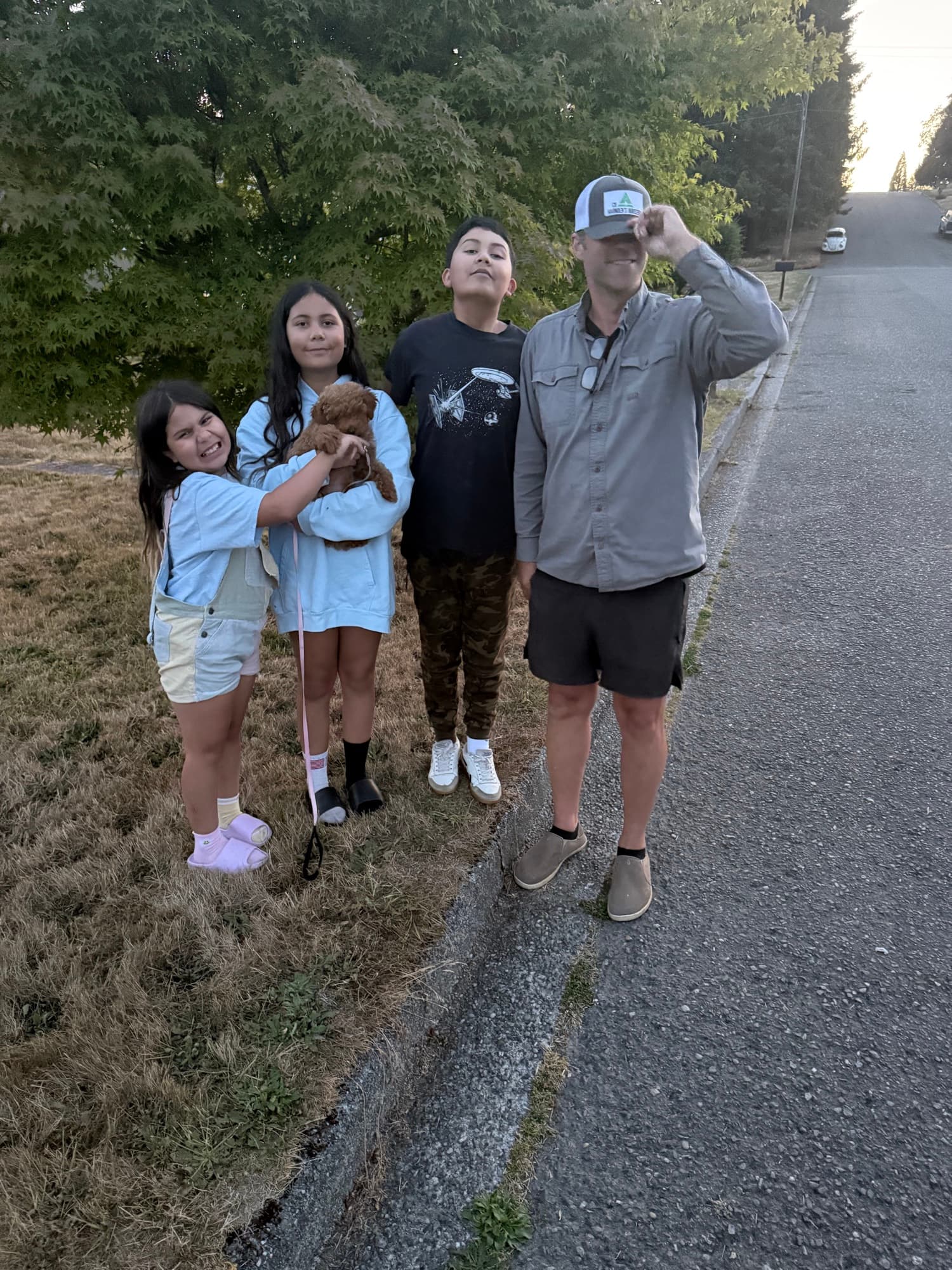 George and the kids on an evening walk with a puppy